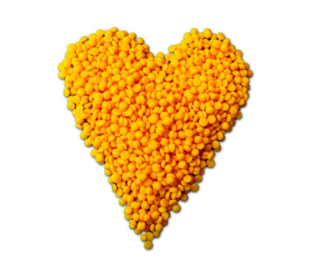 depilatory yellow wax with the shape of heart on white blank backgroundの写真素材