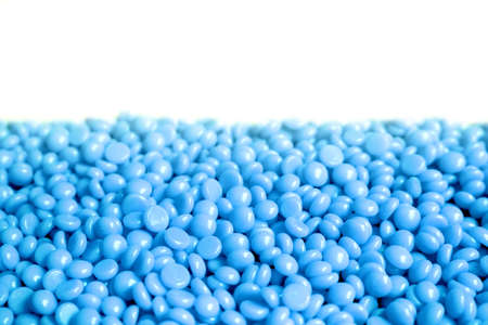 female depilatory hard wax beans with blue color and aa white blank backgroundの写真素材