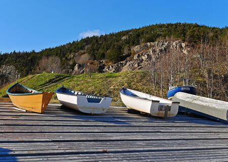 stunning stock image of boats pulled ashore on wharf in summerの写真素材