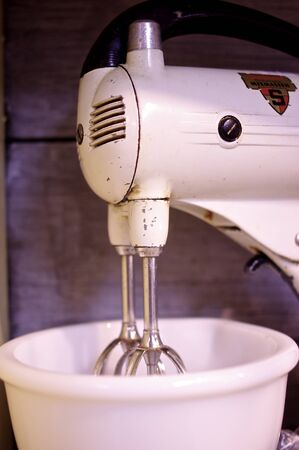 Vintage Sunbeam Standing Electric Kitchen Mixer on display at an antique shop.の写真素材