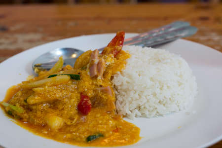 Stir fried ham with curry powder and rice.の写真素材