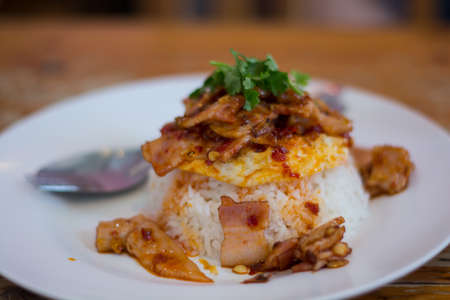 Stir bacon with roasted sweet chilli and  fried eggの写真素材