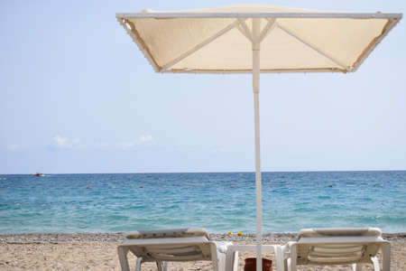 Relaxing on Tropical Beach. Canopy and deck chair on beach by sea. Mediterranean Seaの写真素材