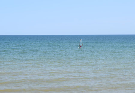 Windsurfing During a Windy Day with a Very Rough Sea. Azov sea, Russia - July 25.2021のeditorial素材