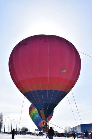 Kharkiv, Ukraine - February 20, 2021: Colorful hot air balloons during airshow. hot air balloon at the balloon festivalのeditorial素材