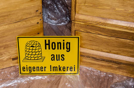 Beekeeper making fresh golden honey from his honey beesの写真素材