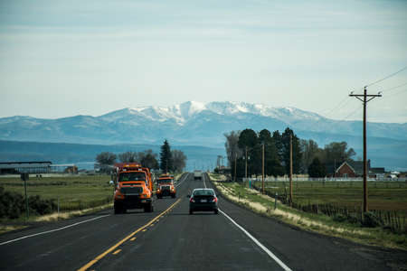 West Coast USA Road with mountain Backgroundの写真素材