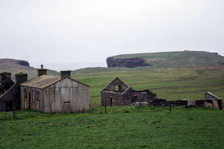 Old left house at Orkney coastline Yesnaby cliff landscapeの写真素材