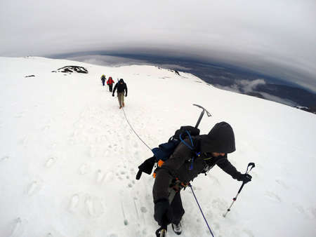 Group Hiking the glacier Hvannadalshnukur highest summit in Iceland mountain landscape Vatnajokull...