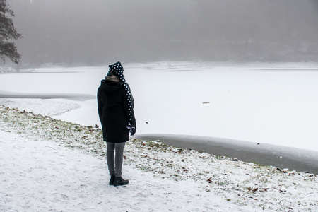 Girl lonely walking path and trees Winter wonder land 3の写真素材