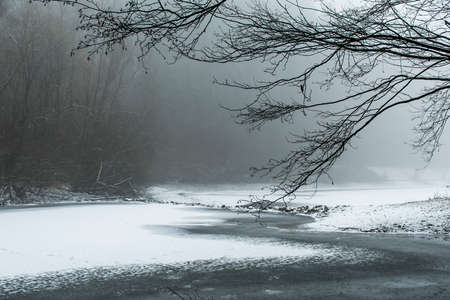 winter winding frozen lake snow covered landscapeの写真素材