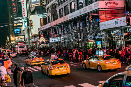 New York City - United States - 25.05.2014 - Times Square by night people walking around and Cars...