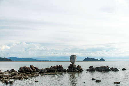 Big shell on rocks near blue ocean with beach background Koh Phangan island Thailandの写真素材