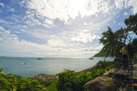 Beautiful tropical coast line Koh Phangan Thailand green palms houseの写真素材
