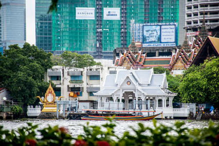 Bangkok Thailand 03.10.2015 Long tail motor boat cruise in front of Wat temple Chao Praya river