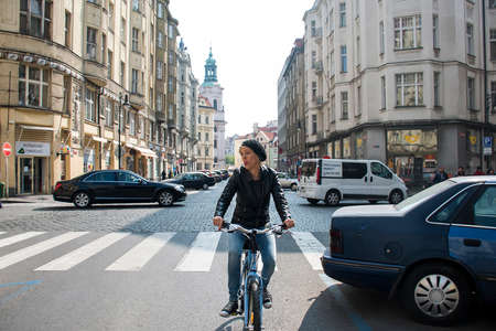 Czech Republic Prague 11.04.2014: Young girl cycling in the capitol city female chilling on a sunny dayのeditorial素材