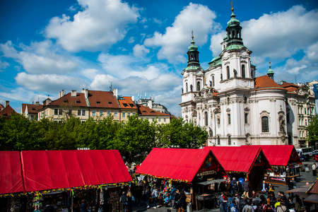 Czech Republic Prague 11.04.2014: People on market in front of saint nikolaus churchのeditorial素材