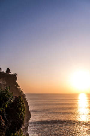 Bali holy Uluwatu Temple coastline ocean sunsetの写真素材