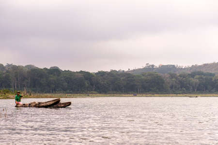 Indonesia Bali 10.10.2015 kanu boat local people at Jungle by lake Tamblinganのeditorial素材