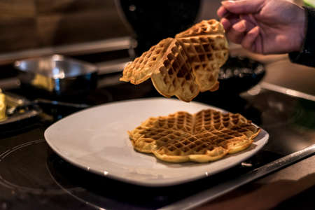 Baking Homemade waffles cooked in a waffle ironの写真素材