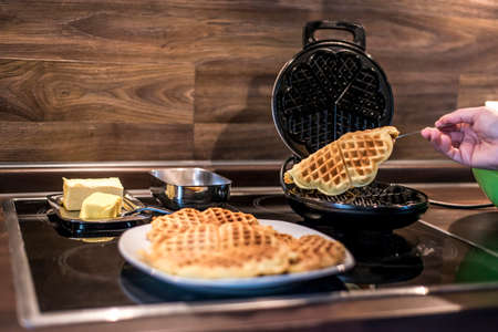 Baking Homemade waffles cooked in a waffle ironの写真素材