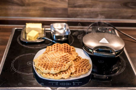 Baking Homemade waffles cooked in a waffle ironの写真素材