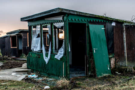 Old creepy dark abandoned destructive dirty house broken windowsの写真素材