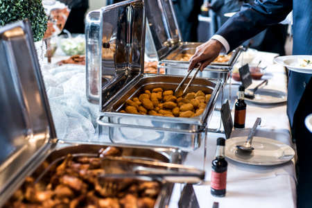 BBQ Chicken wings and nuggets with spicy sauce during a business meeting buffetの写真素材