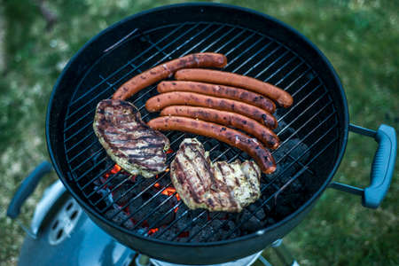 delicious grilled meat over coal on barbecue grill bbq