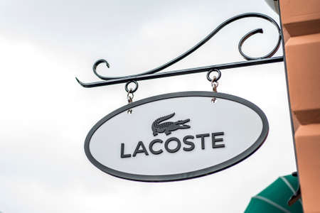 Roermond, Netherlands 07.05.2017 Logo of Lacoste Store in the Mc Arthur Glen Designer Outlet shopping areaのeditorial素材