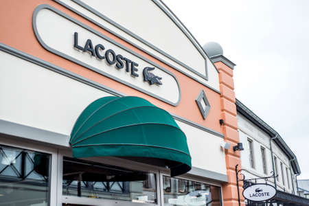 Roermond, Netherlands 07.05.2017 Logo of Lacoste Store in the Mc Arthur Glen Designer Outlet shopping areaのeditorial素材