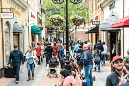 Roermond, Netherlands 07.05.2017 People walking around at the Mc Arthur Glen Designer Outlet shopping center areaのeditorial素材