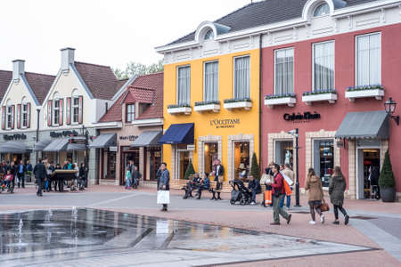 Roermond, Netherlands 07.05.2017 People walking around at the Mc Arthur Glen Designer Outlet shopping center areaのeditorial素材