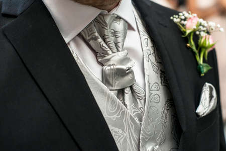 Pink rose boutonniere flower groom wedding coat with tie and shirtの写真素材