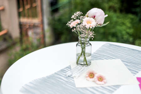 flowers settings decoration outdoor setup for a wedding with pink colored flower