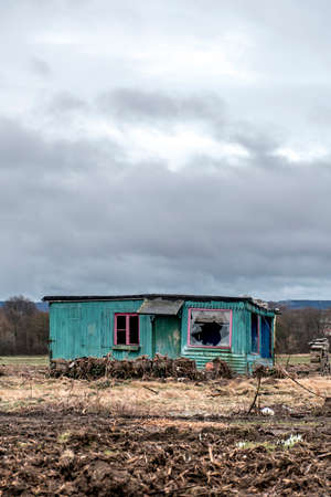 Old creepy dark abandoned destructive dirty house broken windowsの写真素材