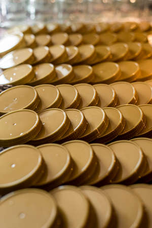 many glass jar empty glasses row for jam honey with lid caps abstract background bokehの写真素材