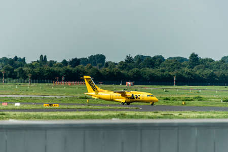 Dusseldorf, Germany 03.09.2017: ADAC air ambulance taxi plane towards runway to depart Dusseldorf International Airportのeditorial素材