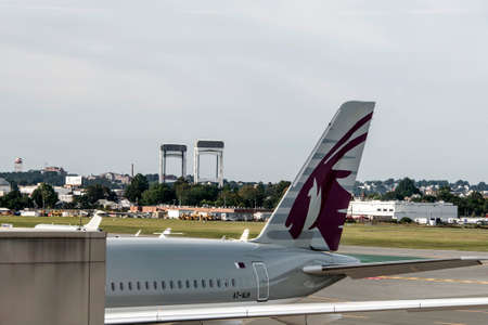 Boston USA 23.09.20170 Vertical Rudder of Qatar Airways Airplane at the airport parking detail Logo