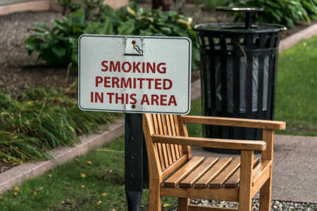 Designated smoking area Outdoor bench smoking zone permittedの写真素材