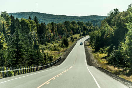 Road through Algonquin Provincial Park beginning fall camper on Street Ontario Canadaの写真素材