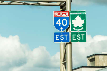 Signpost with green sign of Trans Canada Highway east direction connecting the east- and west coastの写真素材