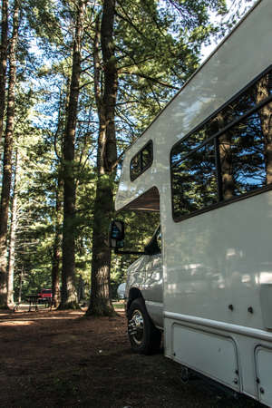 Campground Algonquin National Park. Beautiful natural forest landscape. Parked RV camper carの写真素材