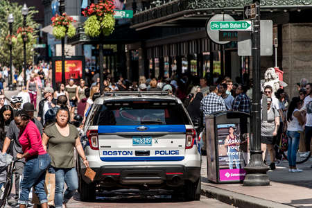 BOSTON MASSACHUSETTS USA 06.09.2017 - Boston Police car in the city between public many people patrolのeditorial素材