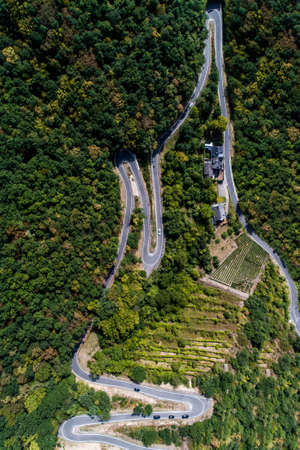 Winding road serpentine from a high mountain pass in the mosel village Brodenbach Germany Aerial...