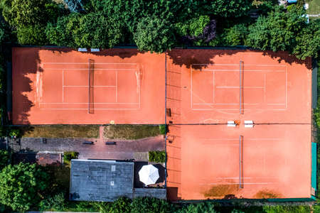 aerial view of a smal local Tennis courts for recreation and tennis training. Sporting area outdoors seen from aboveの写真素材