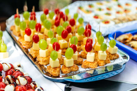 buffet Assortment of canapes. Banquet service. catering food, snacks with mixed fingerfood...