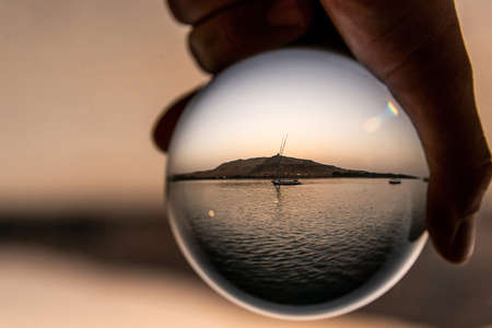 Lens ball Aswan Egypt Sailing boat on The Nile river West Bankの写真素材