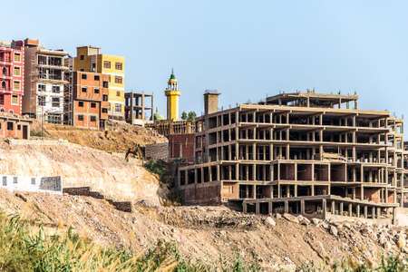 Aswan city Egypt panorama view from a boat on the west coast of the Nile on a sunny day