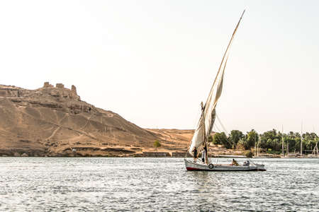 20.05.18 Aswan Egypt Sailing boat on The Nile river West Bankのeditorial素材